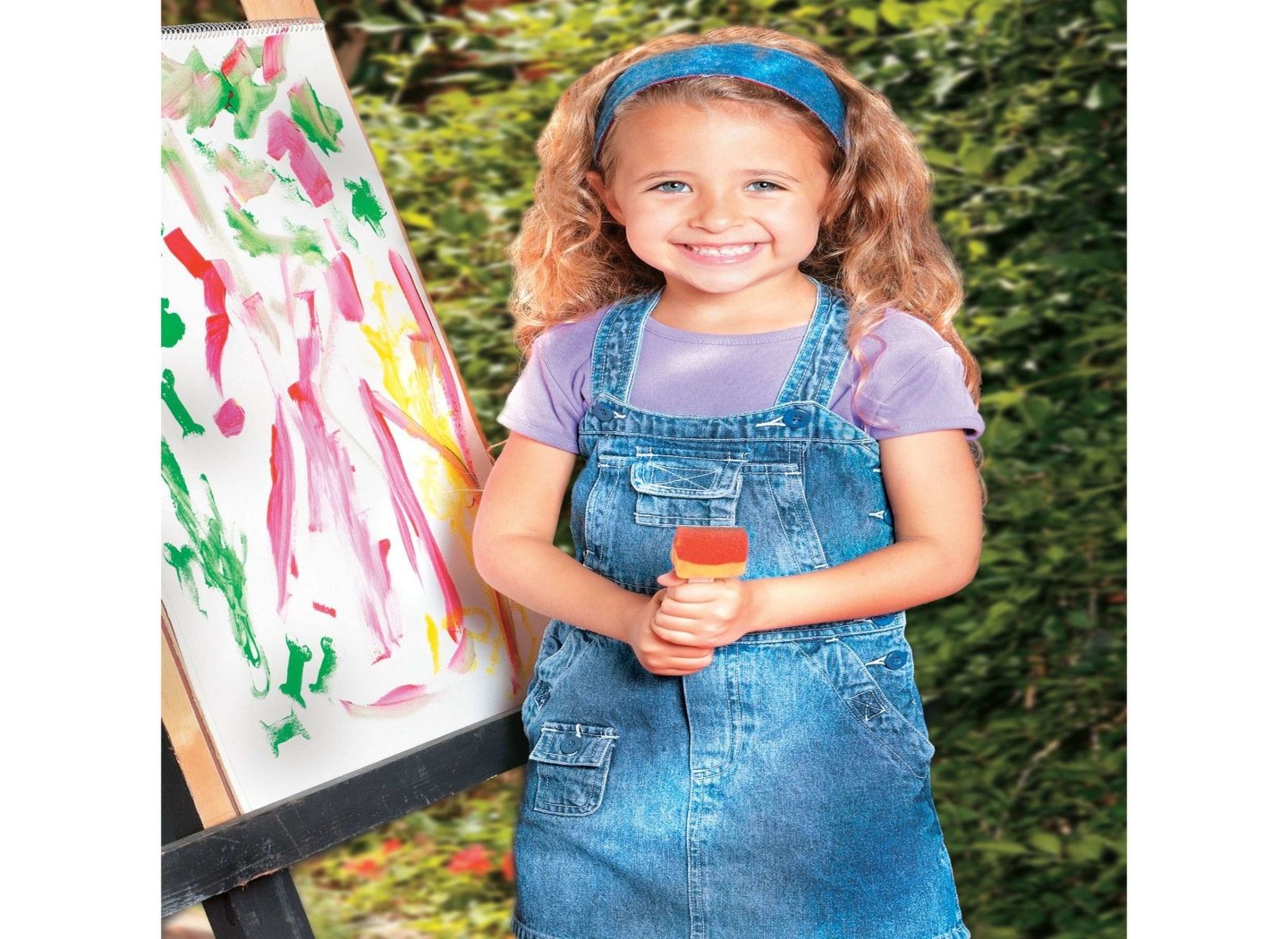 happy-girl-next-to-painting