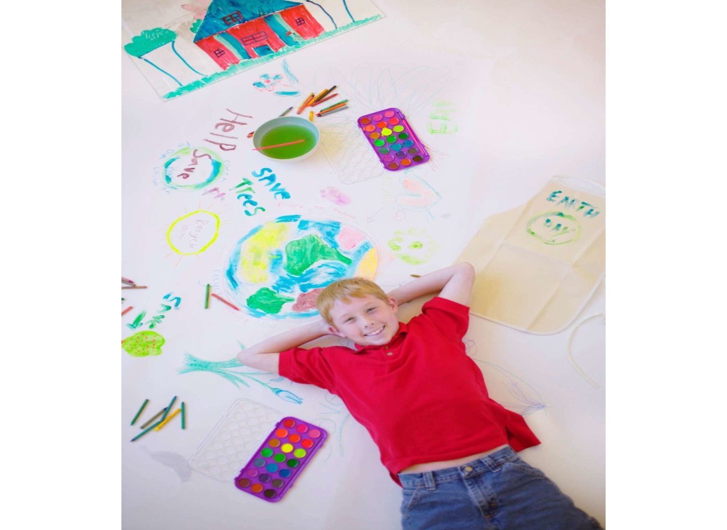 Happy-kid-in-red-by-art-work