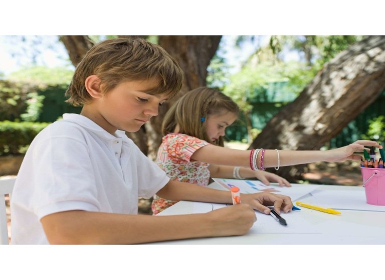 kids-drawing-on-paper-with-crayons