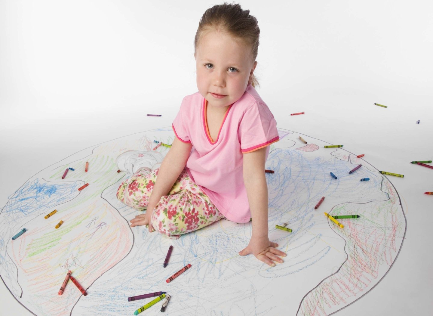 kid-girl-sat-on-painting-on-floor
