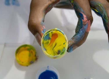 kid-holding-paint-jar