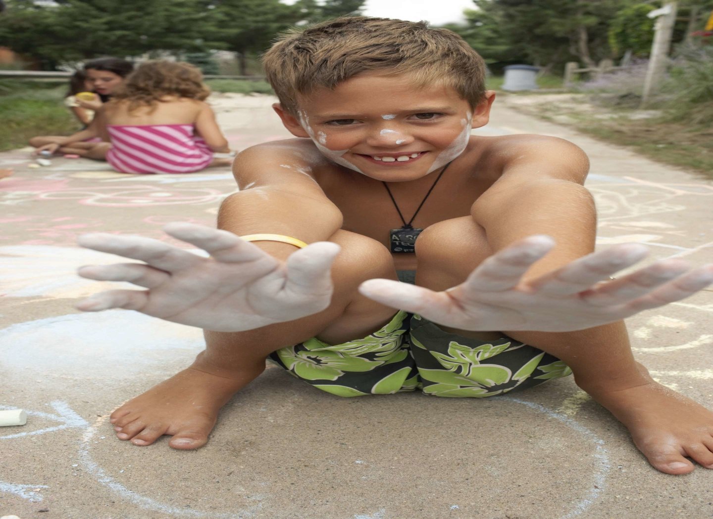 smiling-kid-with-chalk-on-hands