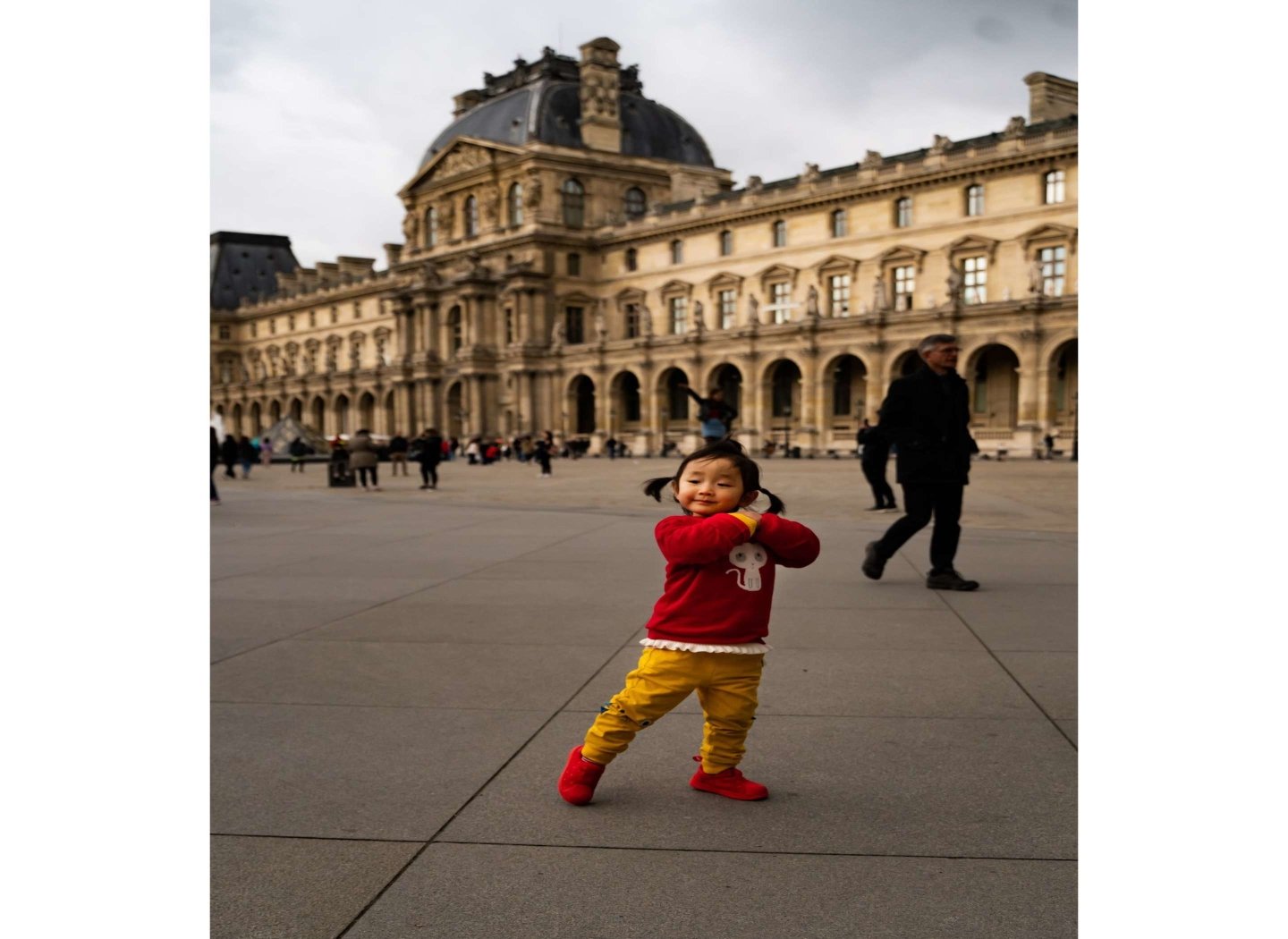 happy-toddler-girl-dancing-in-square
